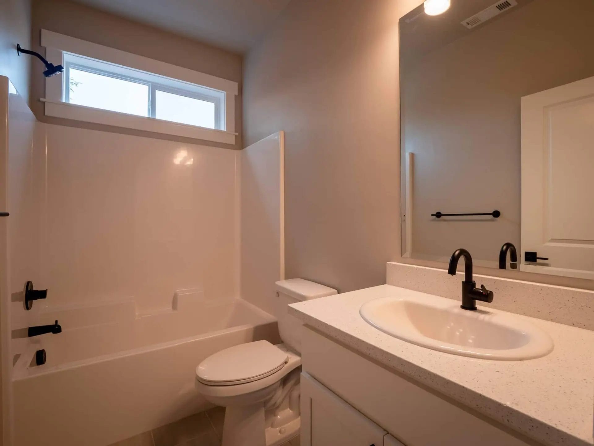 bathroom with a shower with a tub